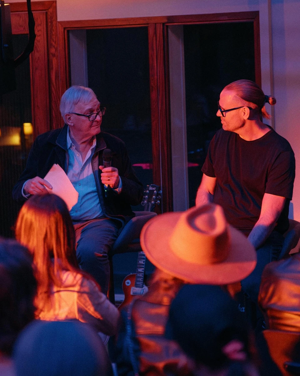 A conversation on stage during the Dolby listening event