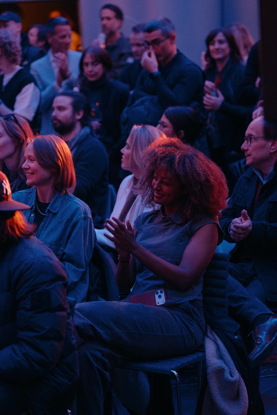 Audience members sharing a moment during a studio performance