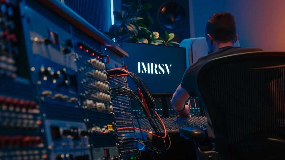 An engineer at the Studio 1 console, with outboard equipment in the foreground