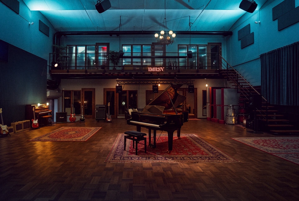 Studio 1 live room with a grand piano and instruments