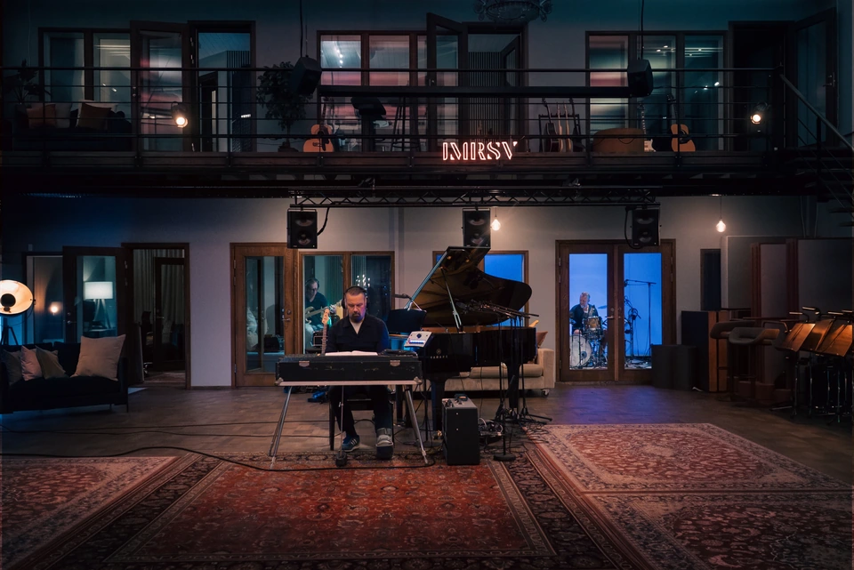 Musicians recording piano, bass and drums together in Studio 1