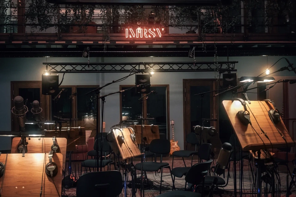Music stands, headphones and microphones ready for a string recording session